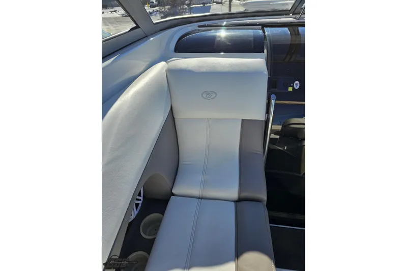 Slide: The Image of Interior seating of 2000 Cobalt 293 boat, featuring gray and white upholstery. - 63