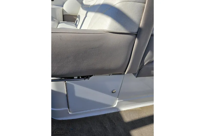 Slide: The Image of Interior seating of a 2000 Cobalt 293 boat, featuring gray upholstery. - 67