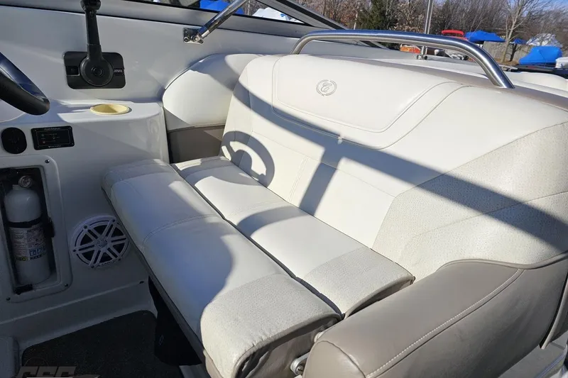 Slide: The Image of Interior of a 2000 Cobalt 293 boat featuring white seating and safety equipment. - 70