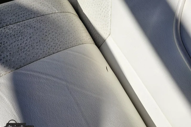 Slide: The Image of Close-up of 2000 Cobalt 293 boat seat with light wear and textured upholstery. - 72