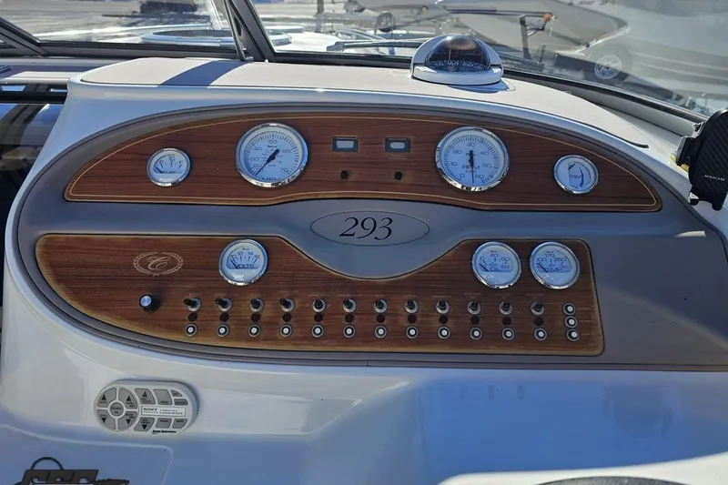 Slide: The Image of Dashboard of a 2000 Cobalt 293 boat with gauges and controls. - 76