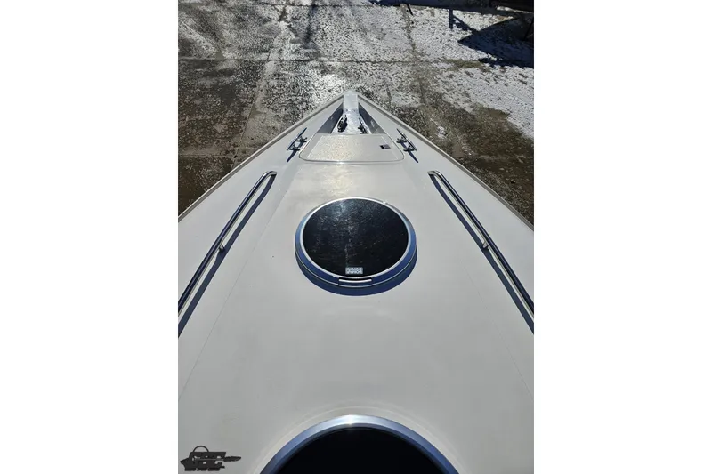 Slide: The Image of Bow view of 2000 Cobalt 293 boat, featuring sleek design and circular hatch. - 82