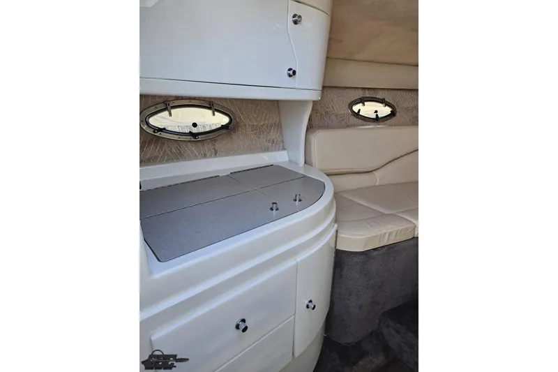Slide: The Image of Interior of 2000 Cobalt 293 boat with seating and storage compartments. - 87