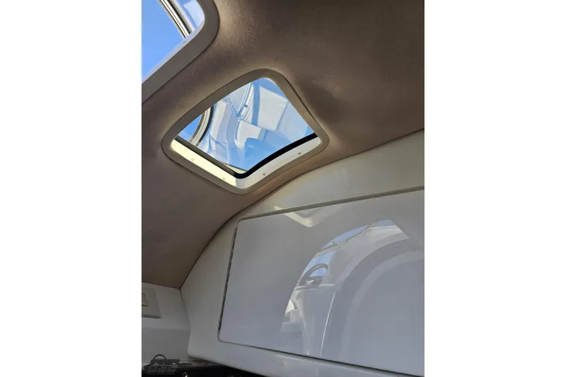 Slide: The Image of Interior view of a 2000 Cobalt 293 boat cabin with a skylight. - 88