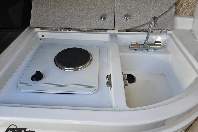 Slide: The Image of Boat kitchen area with stove and sink, Cobalt 293, year 2000. - 92