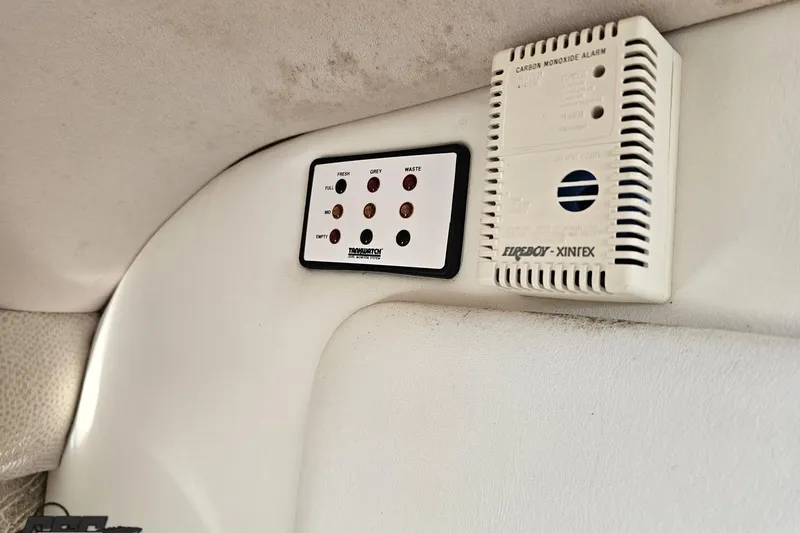 Slide: The Image of Control panel and carbon monoxide alarm in 2000 Cobalt 293 boat interior. - 98