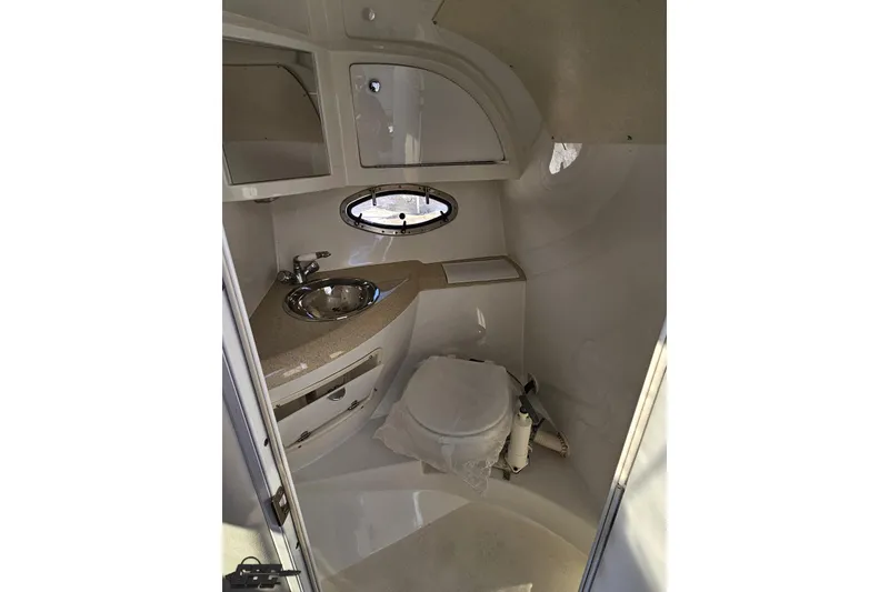 Slide: The Image of Interior of 2000 Cobalt 293 boat bathroom with sink and toilet. - 99