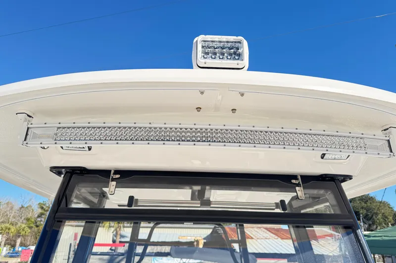 Slide: The Image of 2023 Robalo R302 Center Console boat with advanced LED lighting system. - 12