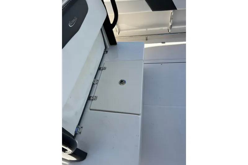 Slide: The Image of 2023 Robalo R302 Center Console boat seating and storage compartment. - 22