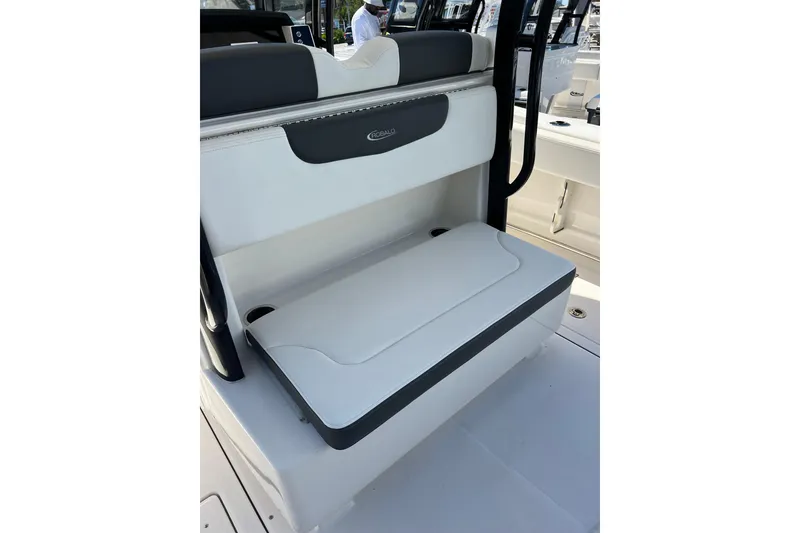 Slide: The Image of 2023 Robalo R302 Center Console boat seat, featuring sleek white and gray design. - 23