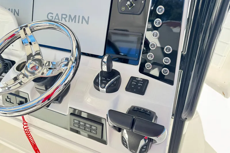 Slide: The Image of 2023 Robalo R302 Center Console dashboard with Garmin displays and controls. - 3