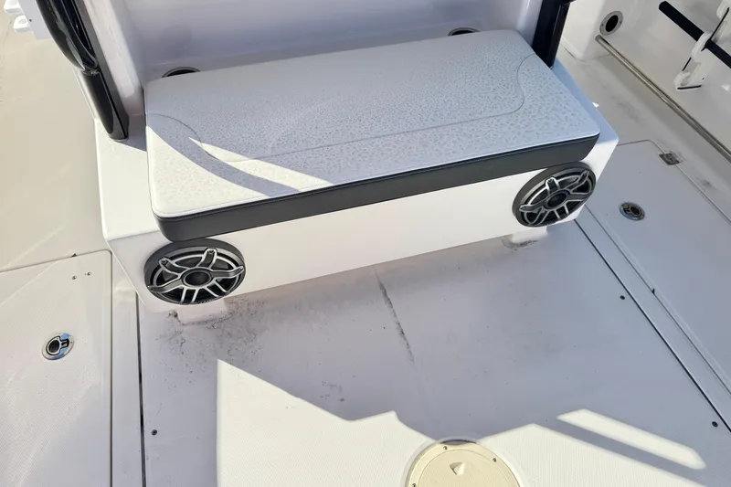 Slide: The Image of 2023 Robalo R302 Center Console boat seating with integrated speakers. - 6