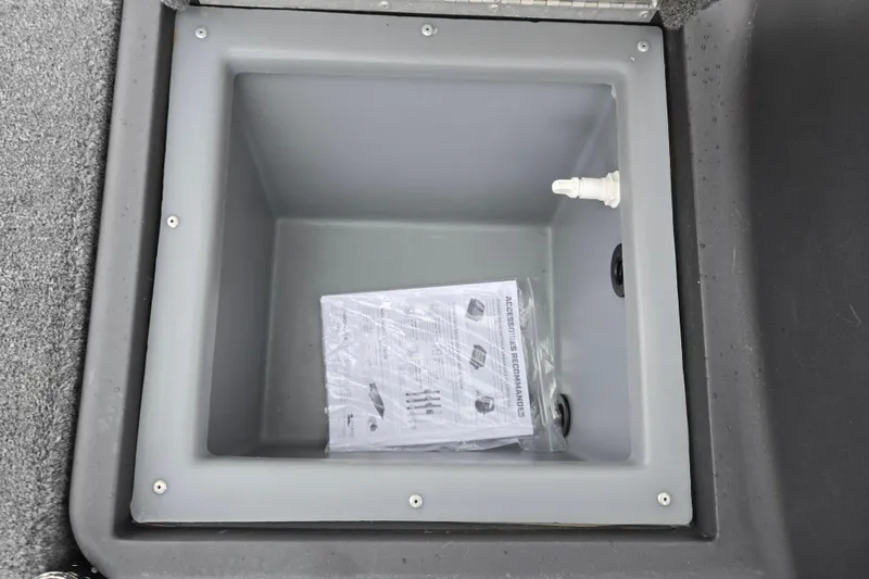 Slide: The Image of 2021 Tracker Bass Tracker Classic XL storage compartment with manual inside. - 15