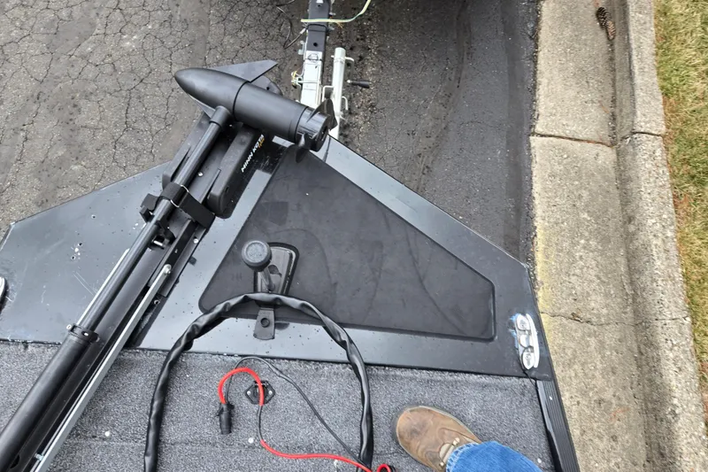 Slide: The Image of 2021 Tracker Bass Tracker Classic XL boat with trolling motor on pavement. - 17