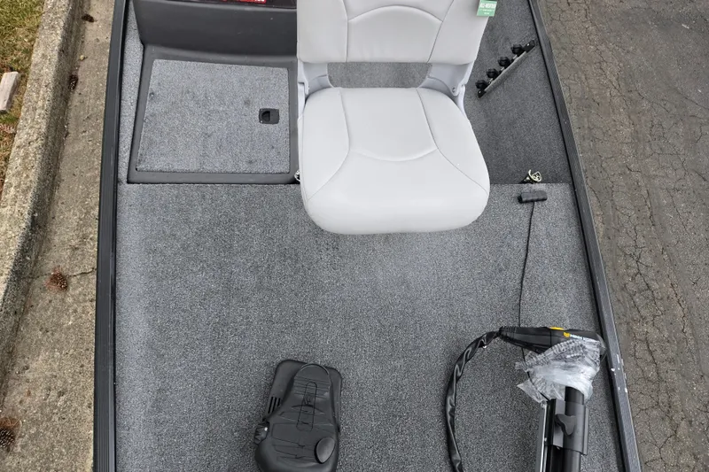 Slide: The Image of 2021 Tracker Bass Tracker Classic XL boat interior with gray carpet and seating. - 18