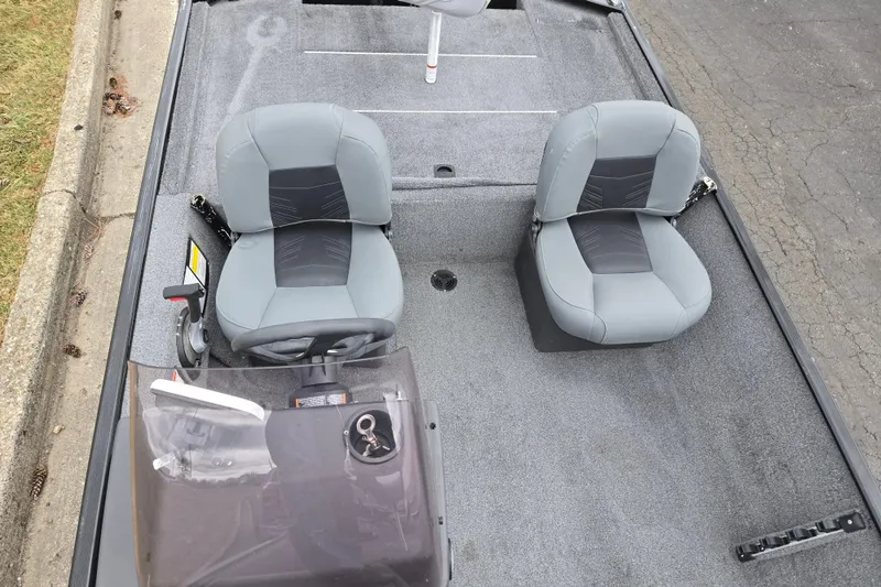 Slide: The Image of 2021 Tracker Bass Tracker Classic XL boat interior with two gray seats and steering console. - 20