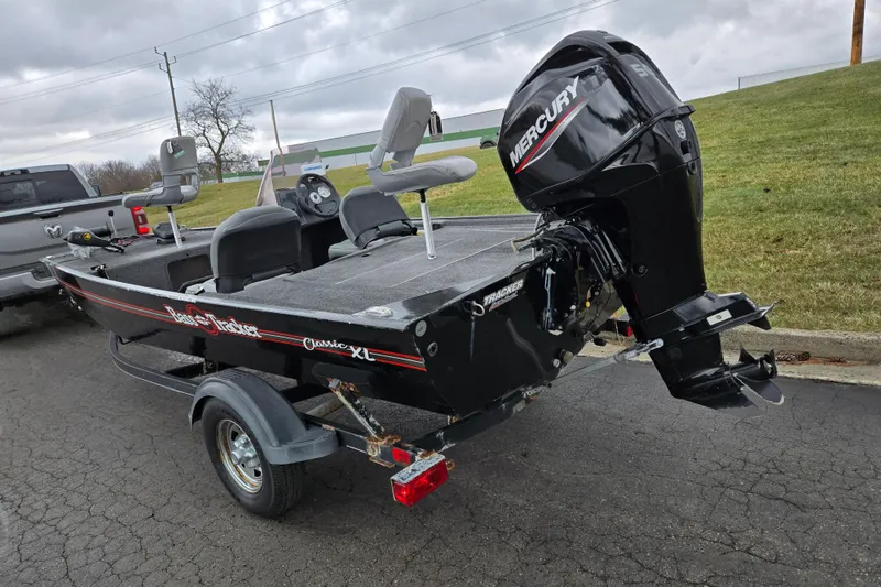 Slide: The Image of 2021 Tracker Bass Tracker Classic XL boat with Mercury outboard motor on trailer. - 3