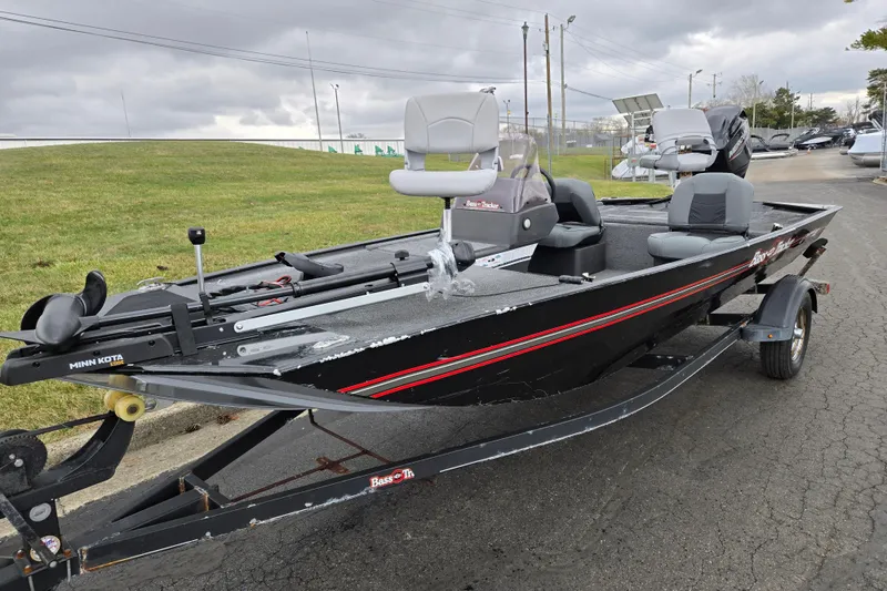 Slide: The Image of 2021 Tracker Bass Tracker Classic XL boat on trailer, overcast sky background. - 6