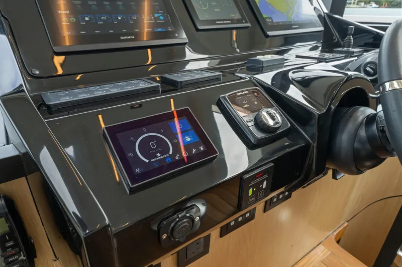 Slide: The Image of The image shows the modern dashboard of a 2026 OKEAN 52 with multiple digital displays. - 47