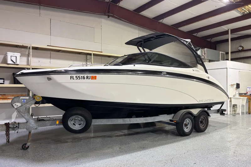 The Image of 2016 Yamaha Boats 242 Limited S on trailer in indoor storage facility. - 0