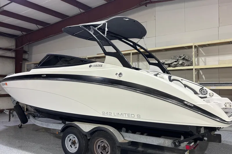 Slide: The Image of 2016 Yamaha Boats 242 Limited S on trailer in indoor storage. - 1