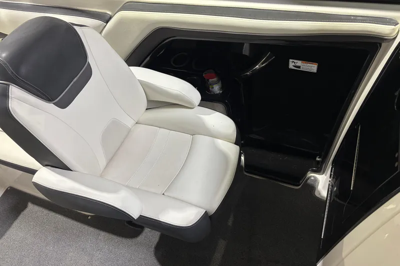 Slide: The Image of 2016 Yamaha Boats 242 Limited S interior with white and black seating. - 13