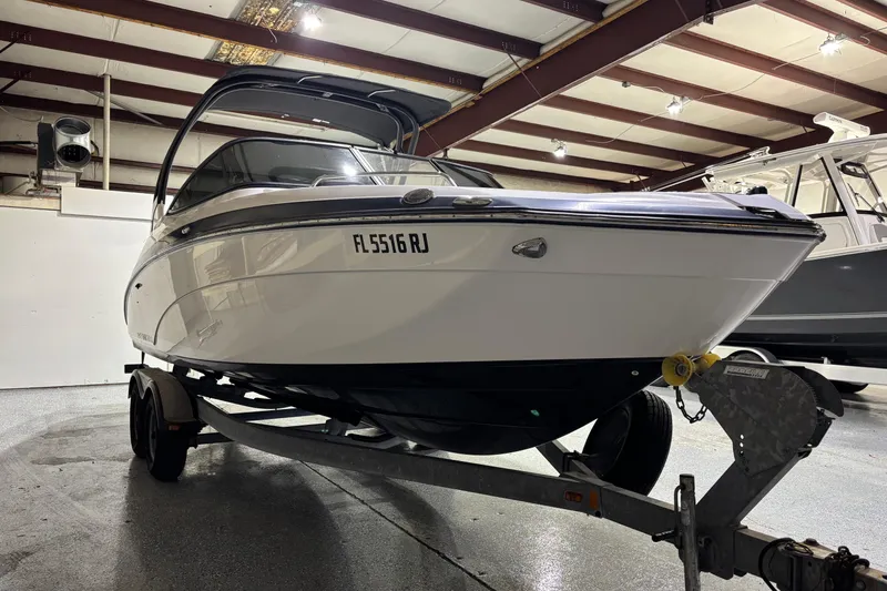 Slide: The Image of 2016 Yamaha Boats 242 Limited S on trailer in indoor storage facility. - 2