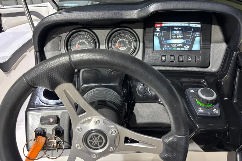 Slide: The Image of Steering wheel and dashboard of 2016 Yamaha Boats 242 Limited S with digital display. - 5