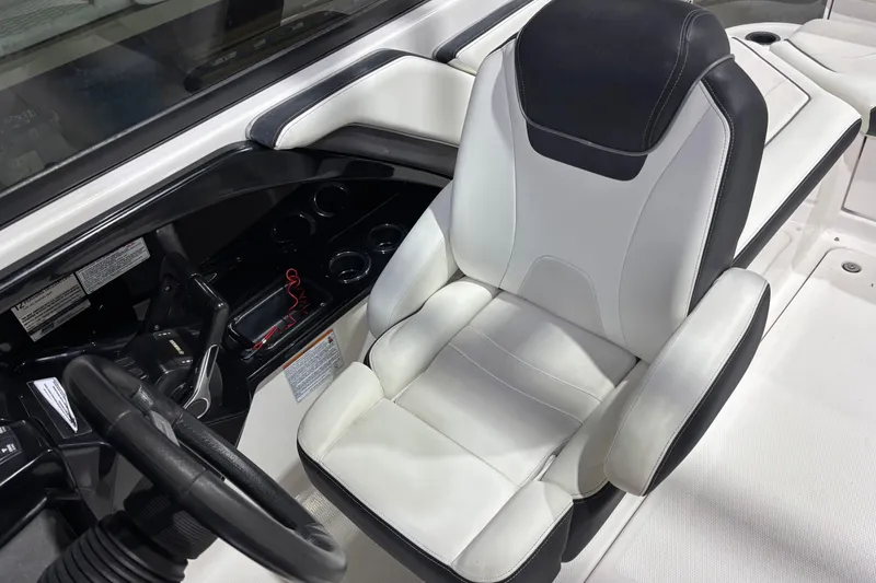 Slide: The Image of Captain's seat and helm of 2016 Yamaha Boats 242 Limited S, featuring sleek design and controls. - 7
