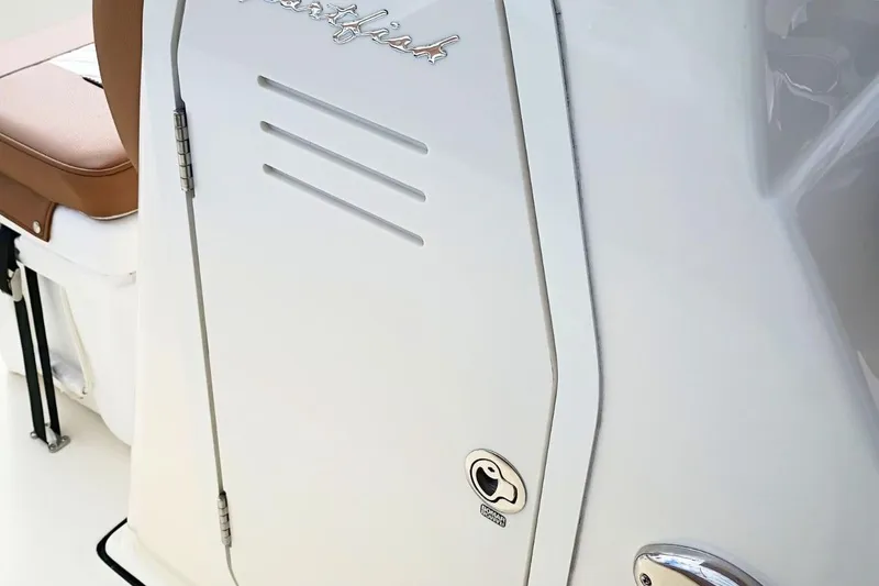 Slide: The Image of 2026 Pioneer 202 Sportfish boat detail with brown seat and white panel. - 13