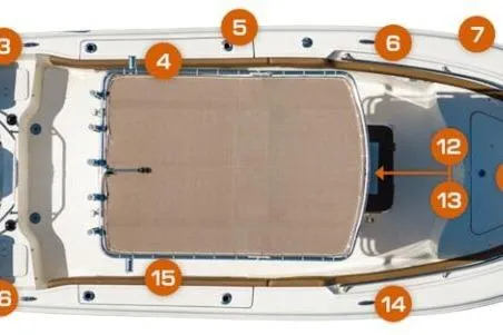 Slide: The Image of 2026 Pioneer 202 Sportfish boat with Suzuki engine, parked under clear blue sky. - 2