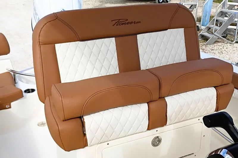 Slide: The Image of Brown and white leather seating on 2026 Pioneer 202 Sportfish boat. - 26