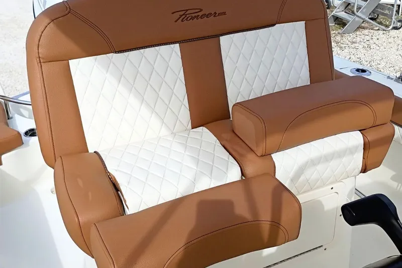 Slide: The Image of 2026 Pioneer 202 Sportfish boat seat with brown and white diamond-pattern upholstery. - 28