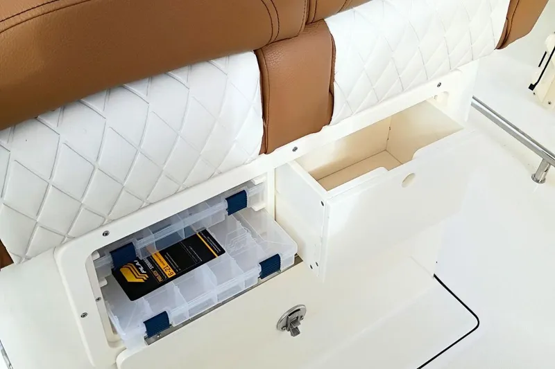 Slide: The Image of Storage compartments on 2026 Pioneer 202 Sportfish boat with cushioned seating. - 30