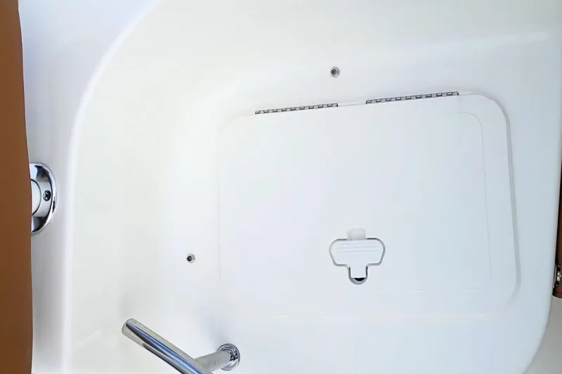 Slide: The Image of Hatch and handle on 2026 Pioneer 202 Sportfish boat interior. - 36
