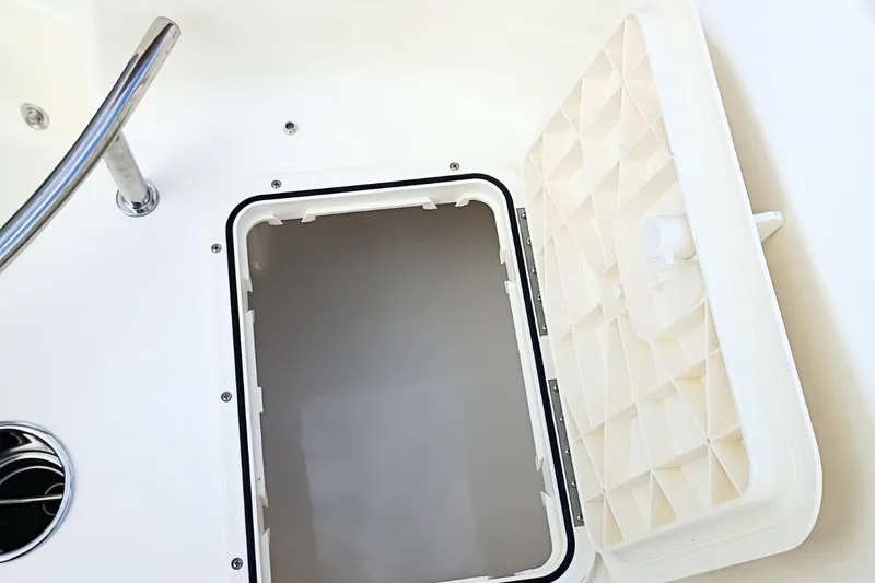 Slide: The Image of Open storage compartment on 2026 Pioneer 202 Sportfish boat, featuring a sturdy lid and sleek design. - 37