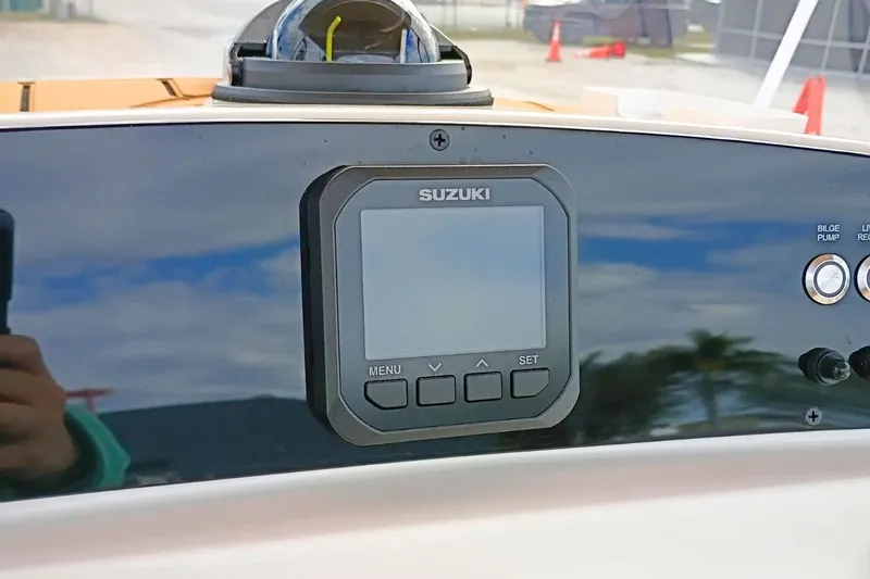 Slide: The Image of Dashboard of 2026 Pioneer 202 Sportfish with Suzuki display and controls. - 9