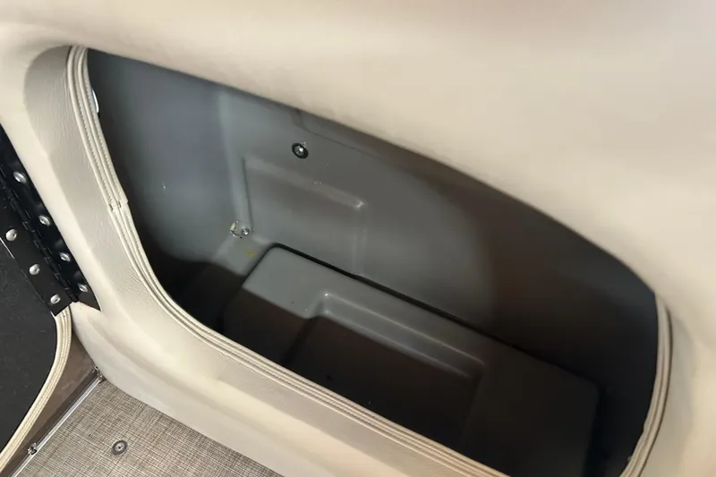 Slide: The Image of 2023 Sun Tracker Party Barge 18 DLX pontoon boat on trailer, parked outdoors. - 13