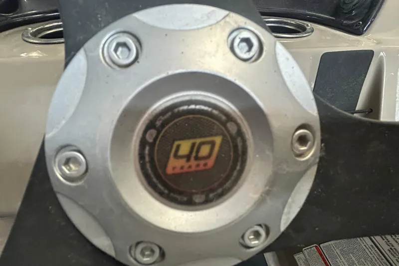 Slide: The Image of 2023 Sun Tracker Party Barge 18 DLX pontoon boat on trailer, side view. - 17