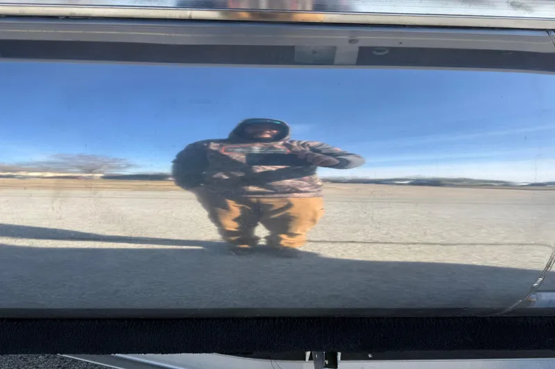 Slide: The Image of Reflection on 2023 Sun Tracker Party Barge 18 DLX's shiny surface. - 23