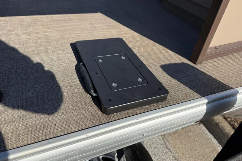 Slide: The Image of 2023 Sun Tracker Party Barge 18 DLX deck with mounted accessory bracket. - 29