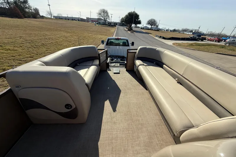 Slide: The Image of 2023 Sun Tracker Party Barge 18 DLX with spacious seating on a trailer. - 33