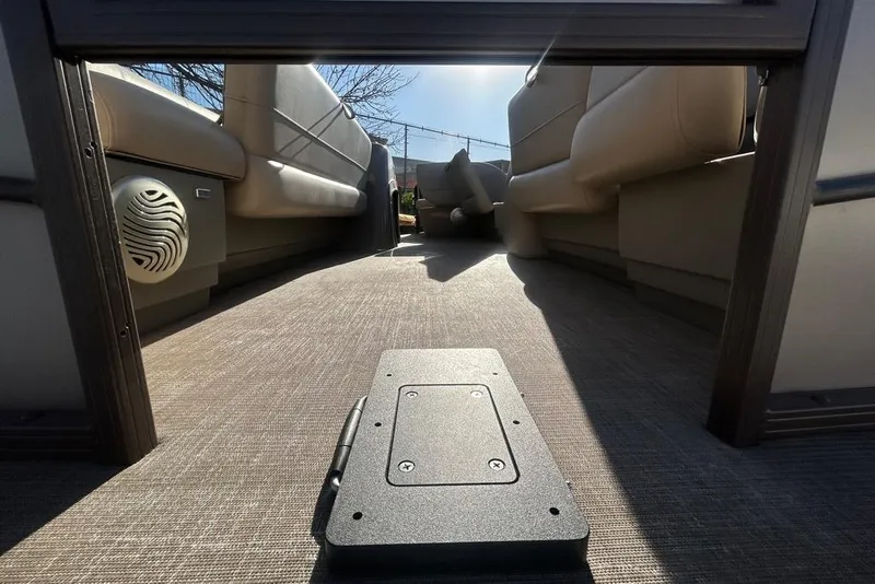 Slide: The Image of 2023 Sun Tracker Party Barge 18 DLX pontoon boat on trailer, side view. - 4