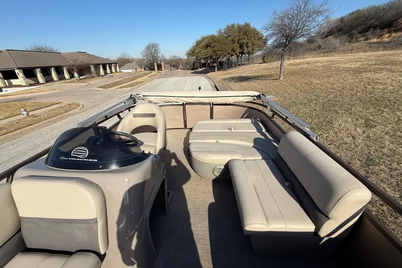 Slide: The Image of 2023 Sun Tracker Party Barge 18 DLX pontoon boat with beige seating and helm. - 40