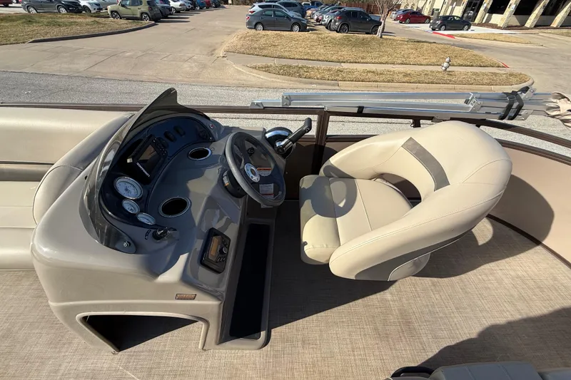 Slide: The Image of 2023 Sun Tracker Party Barge 18 DLX interior with steering console and seating. - 41