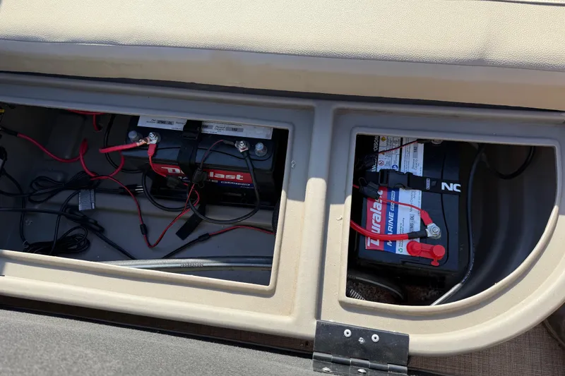 Slide: The Image of 2023 Sun Tracker Party Barge 18 DLX battery compartment with Duralast marine batteries. - 45
