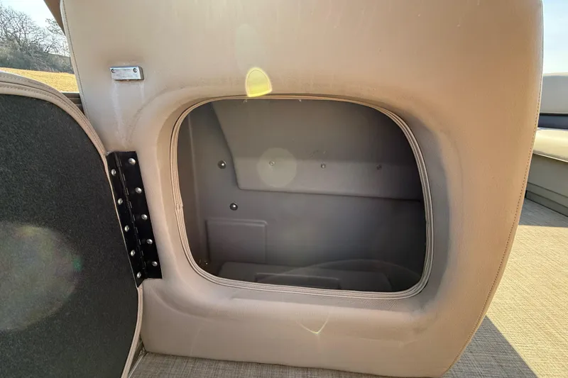 Slide: The Image of 2023 Sun Tracker Party Barge 18 DLX storage compartment with open hatch. - 51