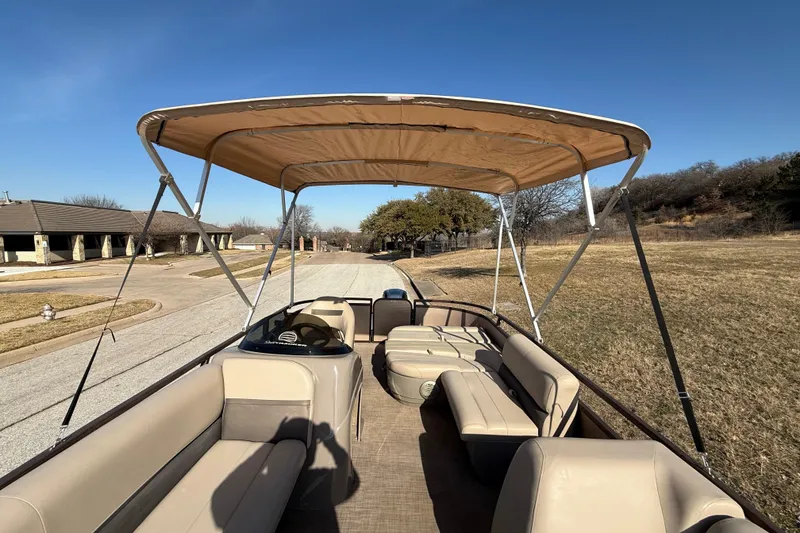 Slide: The Image of 2023 Sun Tracker Party Barge 18 DLX pontoon boat with canopy on a sunny day. - 52