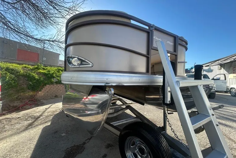 Slide: The Image of 2023 Sun Tracker Party Barge 18 DLX pontoon boat with Mercury 75 engine on a sunny day. - 9