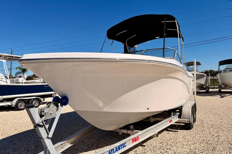 Slide: The Image of 2023 Sea Fox 228 Traveler boat on trailer under clear blue sky. - 1